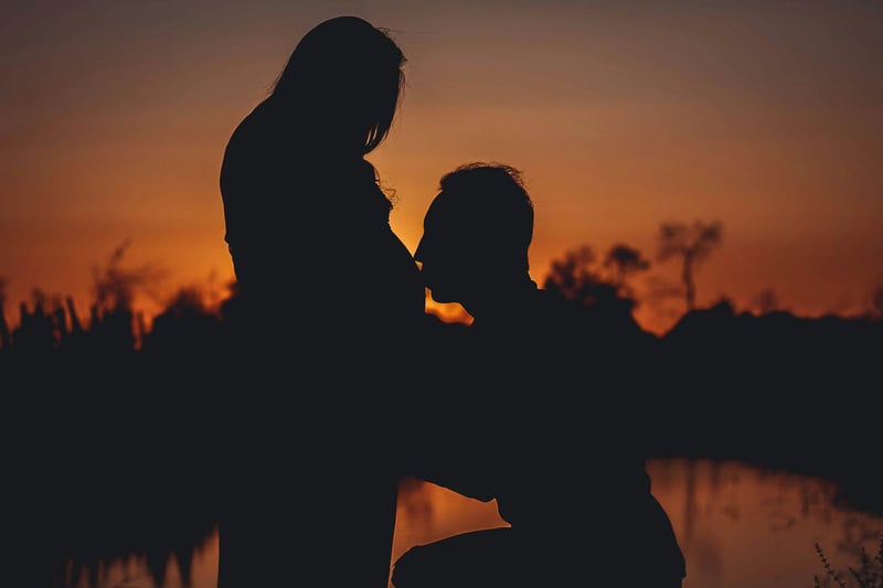 Man Kissing His Wife Pregnant Stomach