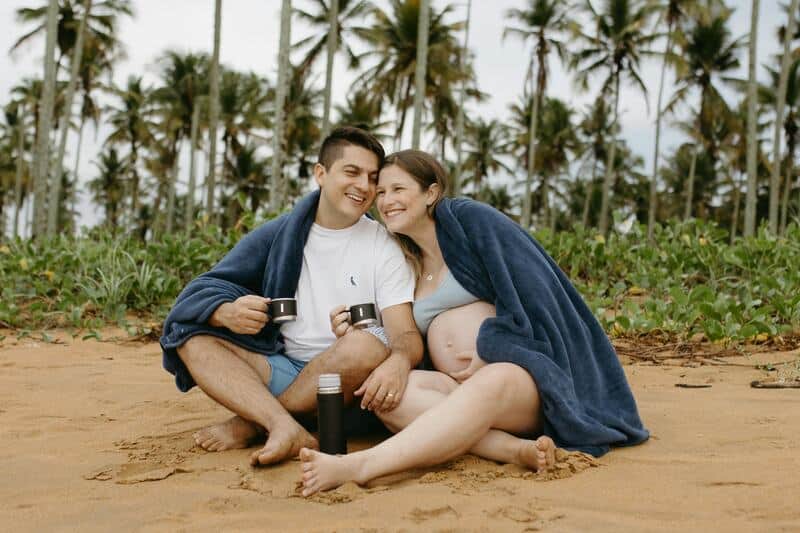 Pregnant Couple At Beach