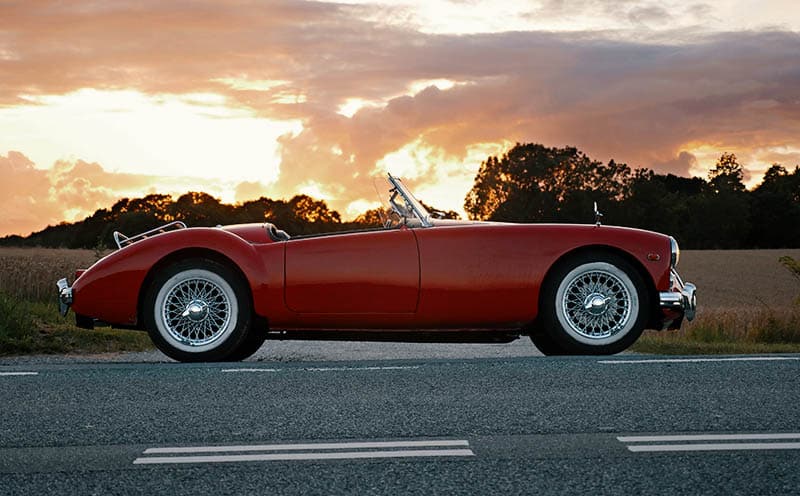 red convertibles sunset