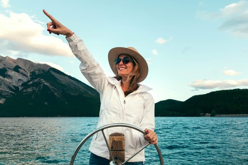 woman driving boat in ocean